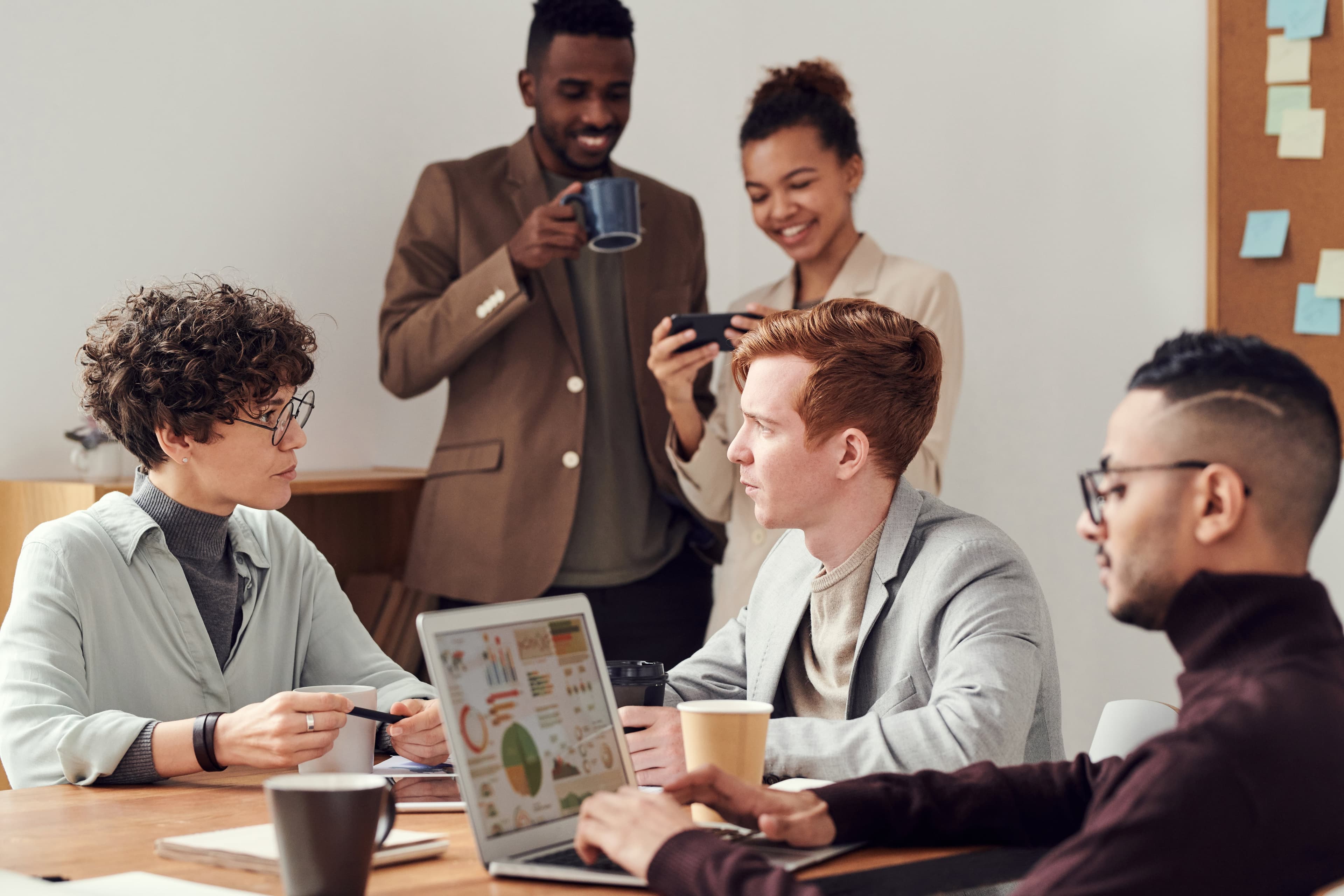 A photo of two employees have a conversation